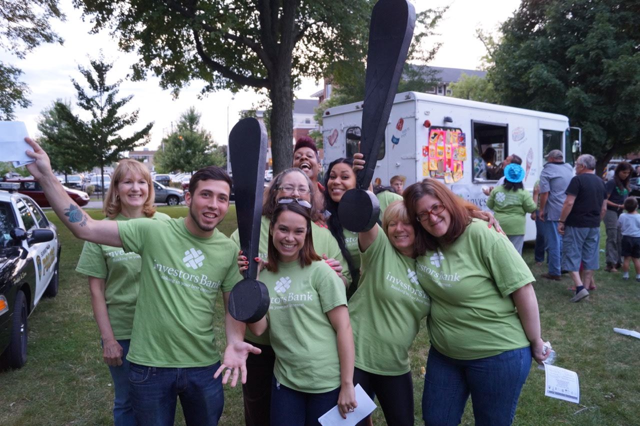Investors Bank representatives pose with the Share the Fun exclamation points.